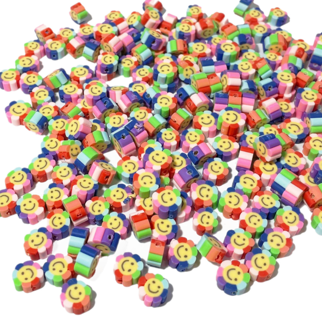 CUENTAS FIMO FLORES 9X5MM