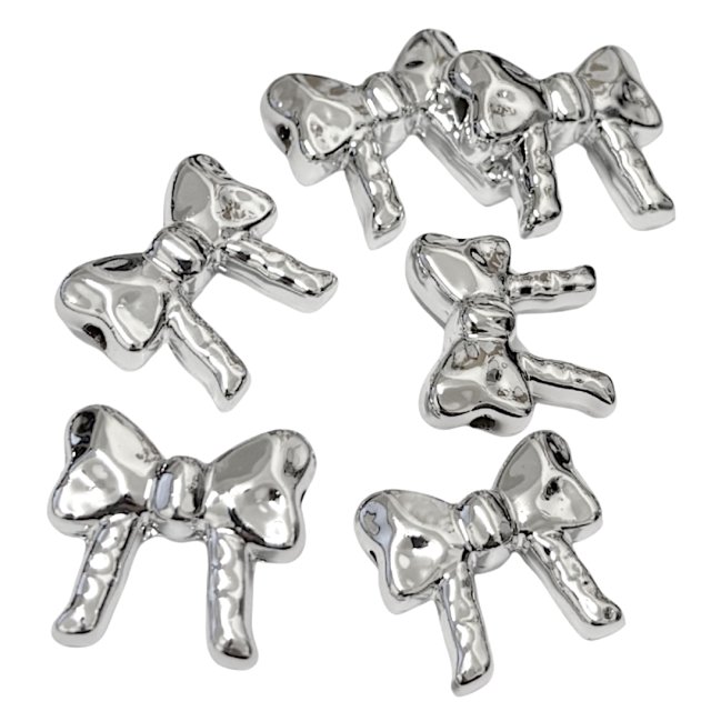 DIJE MOÑA 23X25MM - PLASTICO (SEPARADOR)