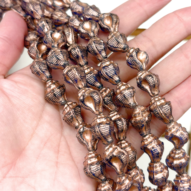 CRISTAL CHECO COBRE CARACOL 15X11MM (X TIRA)