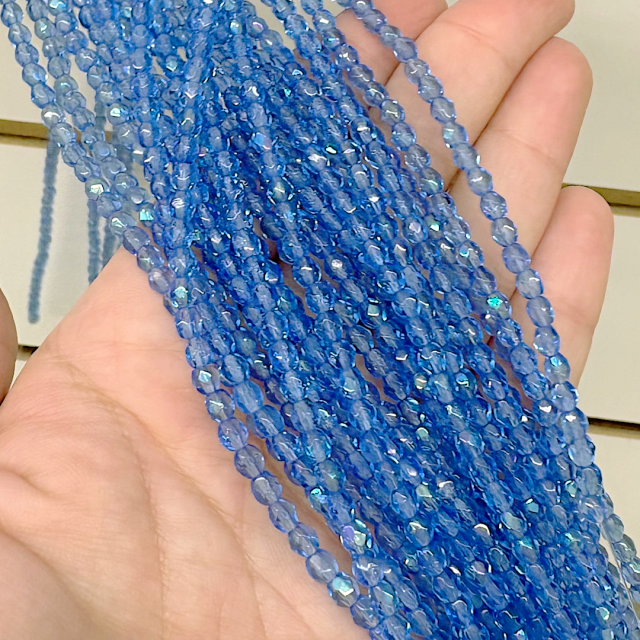 CRISTAL CHECO FACETADO 4MM TRANSPARENTE TORNASOL CELESTE (X TIRA)