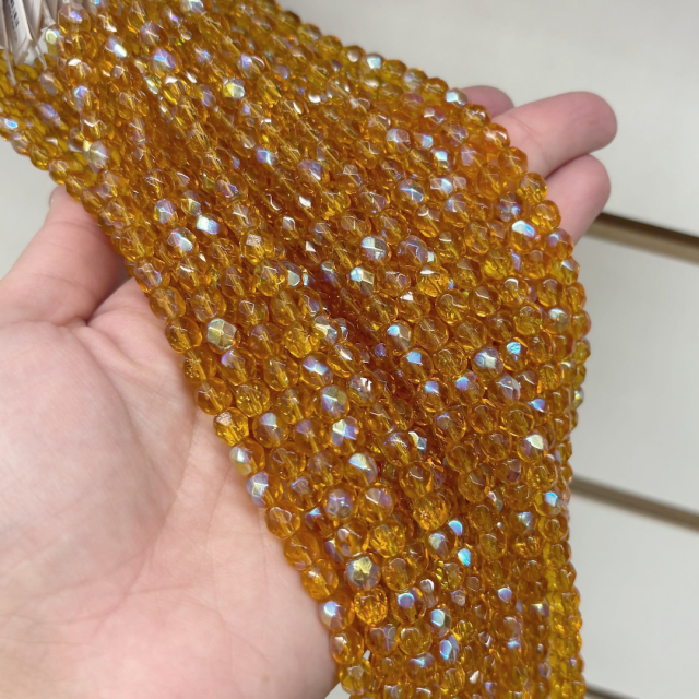 CRISTAL CHECO FACETADO 6MM TRANSPARENTE TORNASOL AMBAR  (X TIRA)